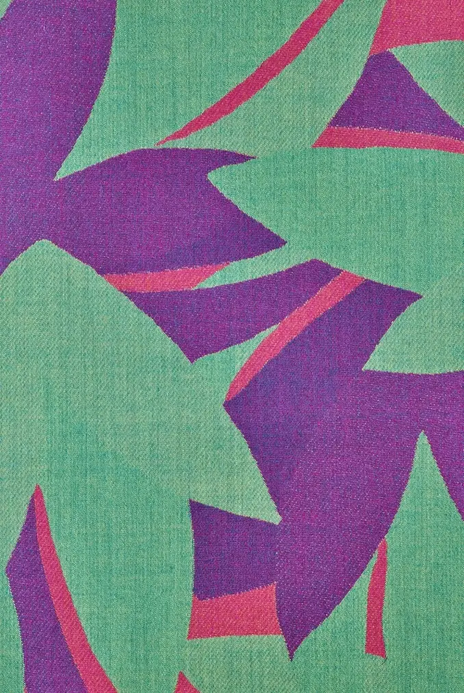 A colorful pattern in greens, purples, and reds suggests an abstract floral motif.