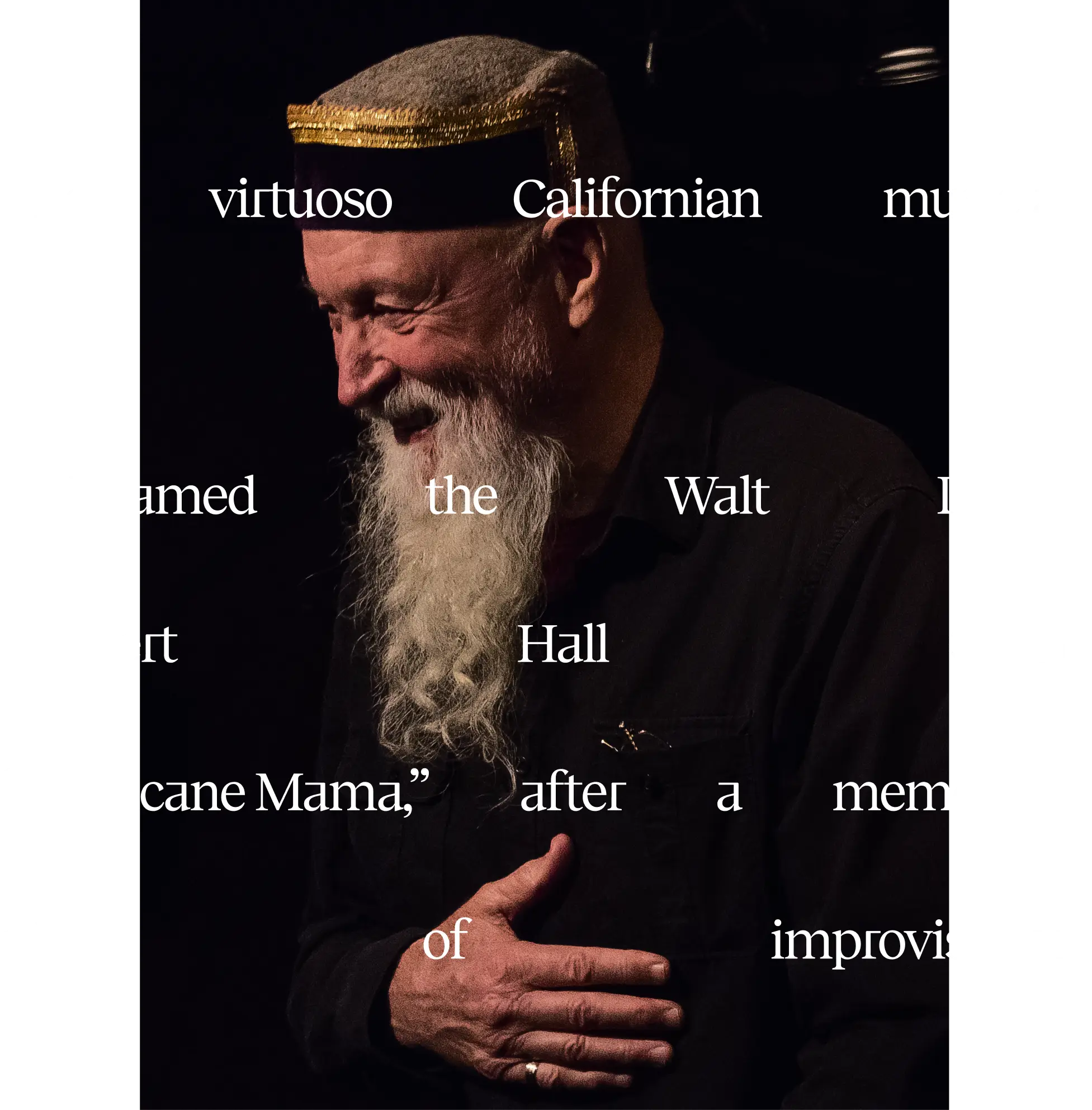 American composer and musician Terry Riley dressed in a black shirt that contrasts his long white beard.