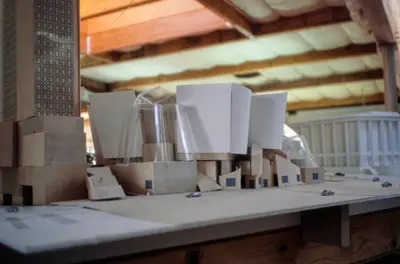 A pedestrian's-eye view of a model of Walt Disney Concert Hall constructed in wood, paper, and acrylic suggests the dynamic form of the building.